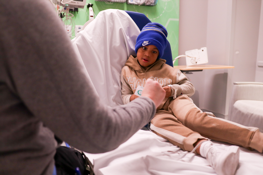 patient receiving sticker from a doctor