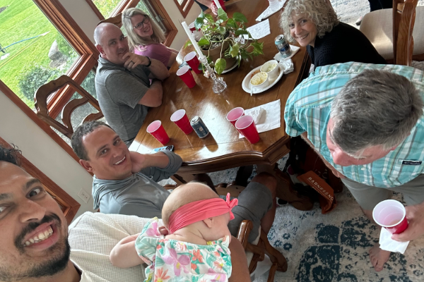 selfie of members of the department sitting around a table