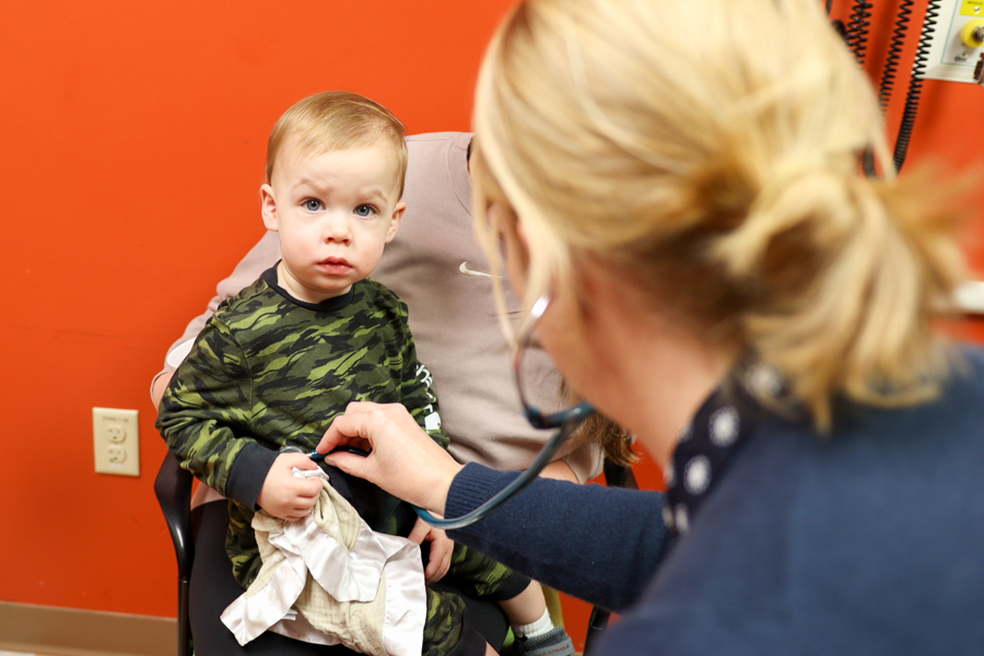 Physician examining a patient