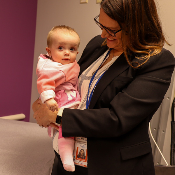 Nephrologist holding baby