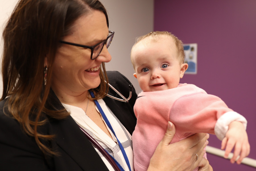 Nephrologist holding baby