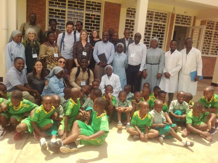 Teachers and students outside a school in Rwanda.