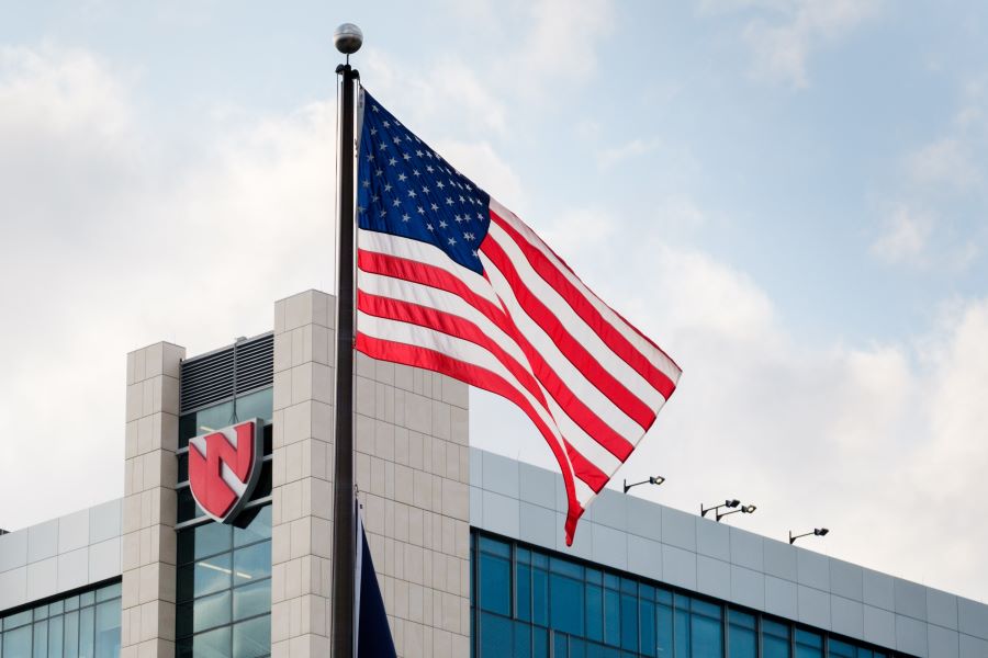 U.S. flag flying outside near UNMC Buffett Cancer Center.